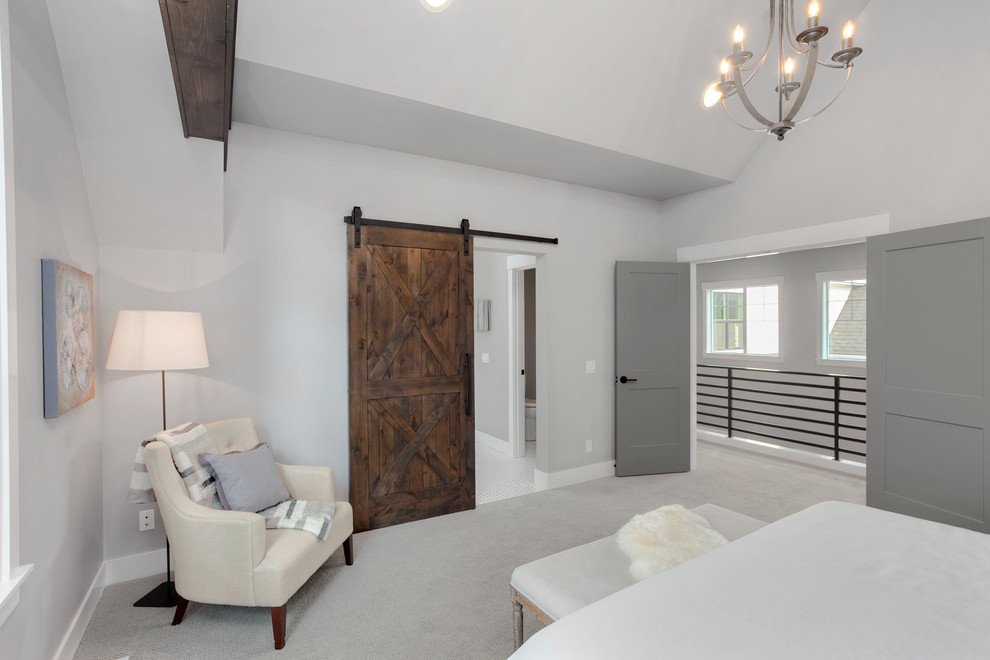 Inspiration for a large rural master bedroom in Seattle with grey walls, carpet and grey floors.