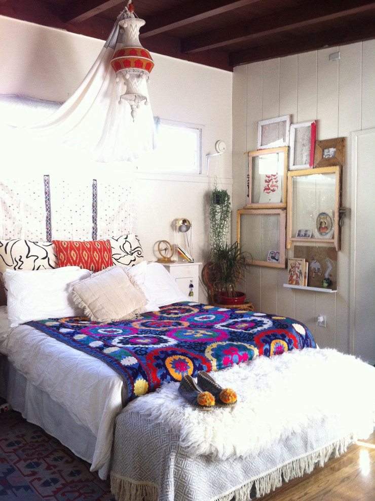 Inspiration for an eclectic bedroom in Los Angeles with white walls.