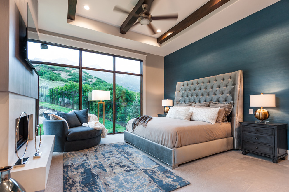 Foto de dormitorio principal clásico renovado de tamaño medio con paredes azules, moqueta, todas las chimeneas y marco de chimenea de piedra