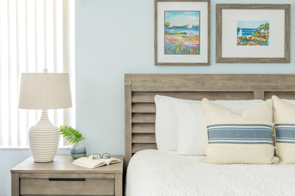Design ideas for a large coastal master bedroom in Other with blue walls and vinyl flooring.