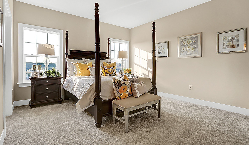 Inspiration for a mid-sized transitional master carpeted bedroom remodel in Other with beige walls and no fireplace