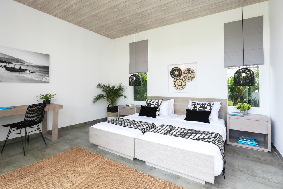 Diseño de dormitorio tropical con paredes blancas y suelo gris