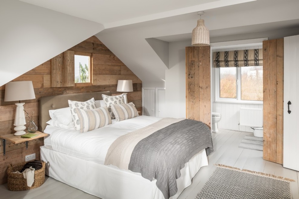 Photo of a beach style bedroom in Sussex.