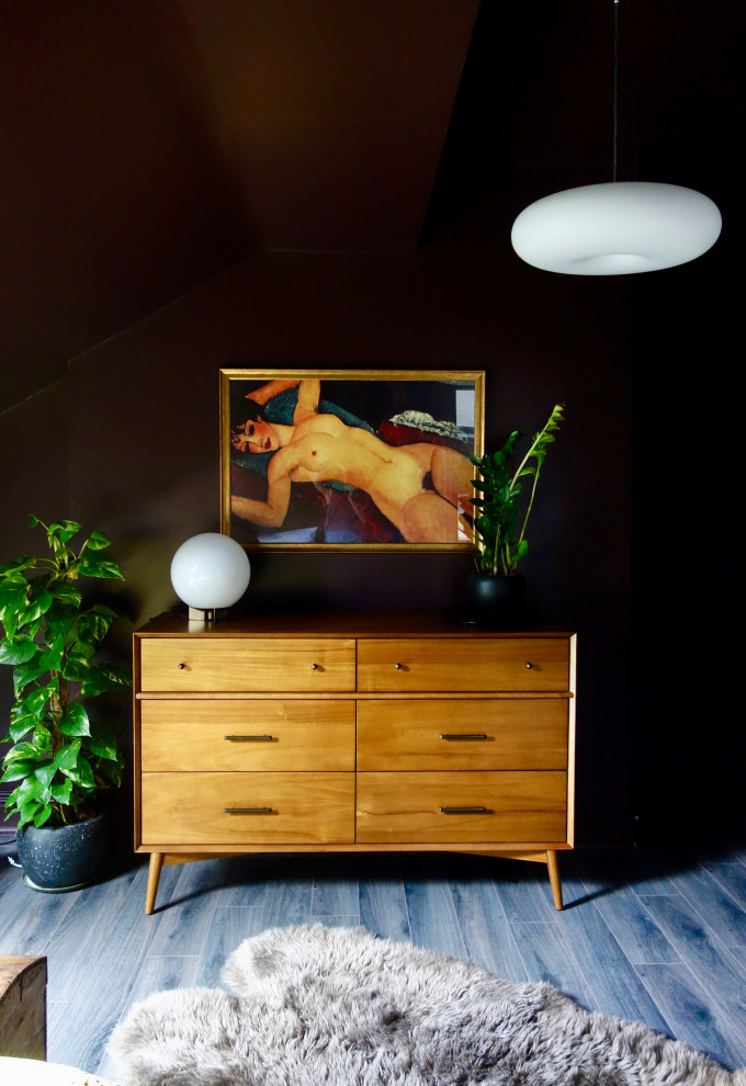 Inspiration for a medium sized midcentury master bedroom in Other with purple walls, laminate floors and brown floors.