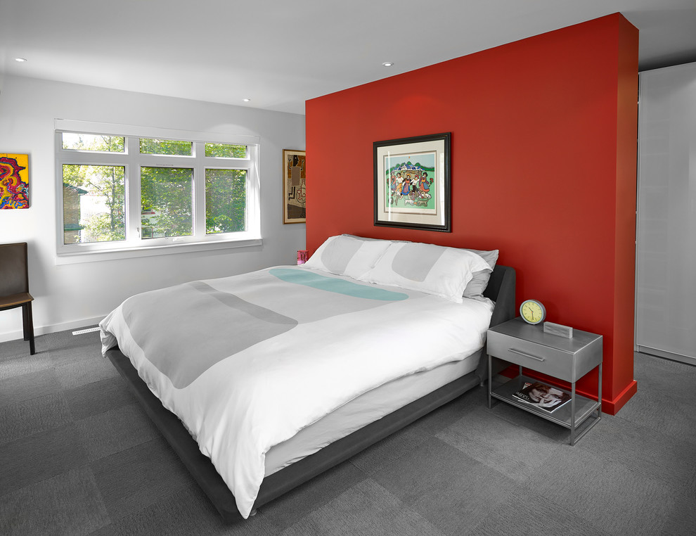 This is an example of a medium sized contemporary guest and grey and silver bedroom in Edmonton with red walls, carpet and no fireplace.