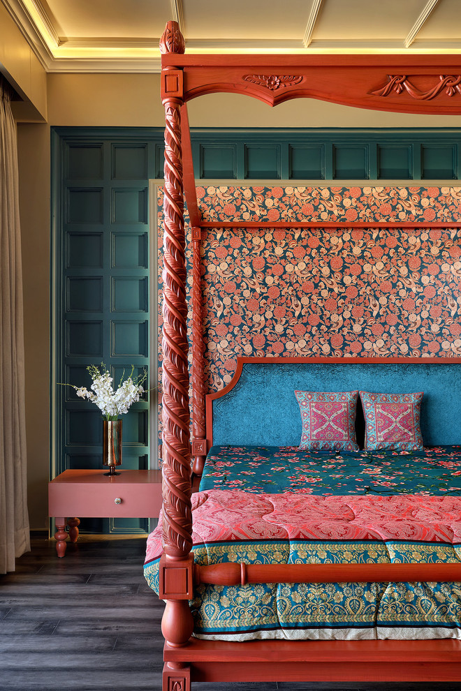 Photo of a world-inspired master and grey and pink bedroom in Ahmedabad with blue walls, dark hardwood flooring, grey floors and a feature wall.