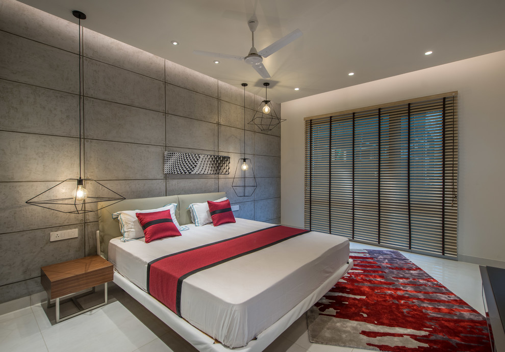 This is an example of a medium sized contemporary bedroom in Hyderabad with white walls and white floors.