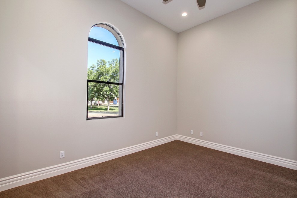 Inspiration for a mid-sized transitional master carpeted and beige floor bedroom remodel in Phoenix with beige walls