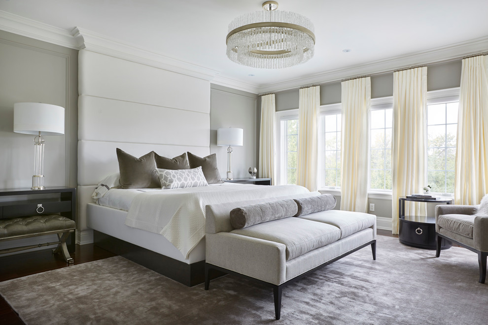 Large traditional master and grey and cream bedroom in Toronto with grey walls and dark hardwood flooring.