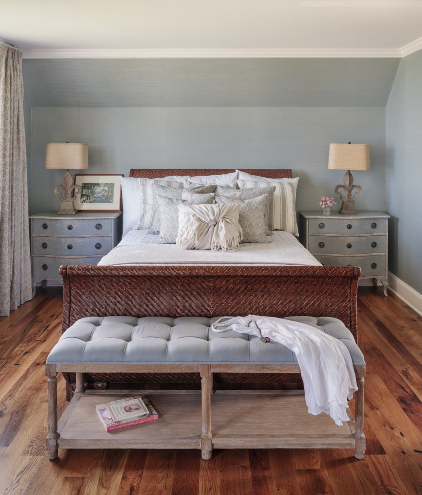 Coastal grey and brown bedroom in Portland Maine with grey walls, medium hardwood flooring, no fireplace and brown floors.