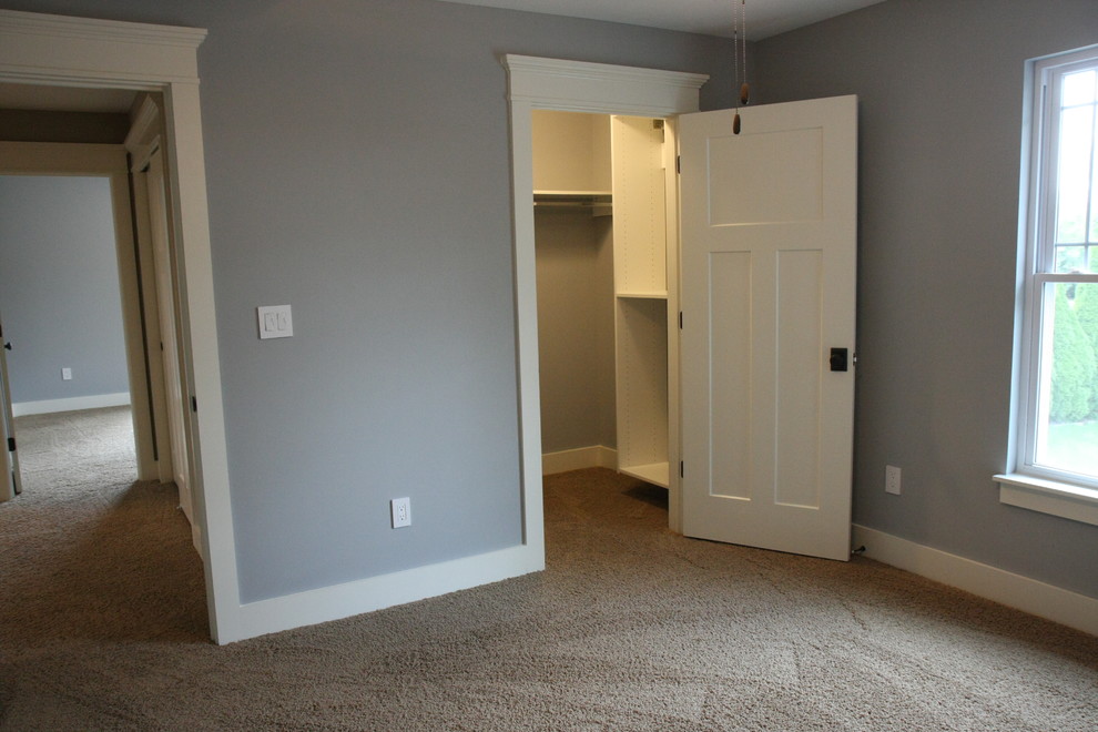 Example of a mid-sized transitional guest carpeted and beige floor bedroom design in Indianapolis with gray walls