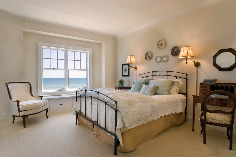 Design ideas for a large nautical master bedroom in Milwaukee with beige walls, carpet, no fireplace and beige floors.