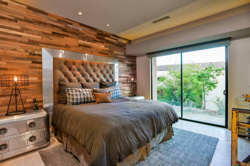 Photo of a large industrial guest bedroom in Other with beige walls, travertine flooring, no fireplace and beige floors.