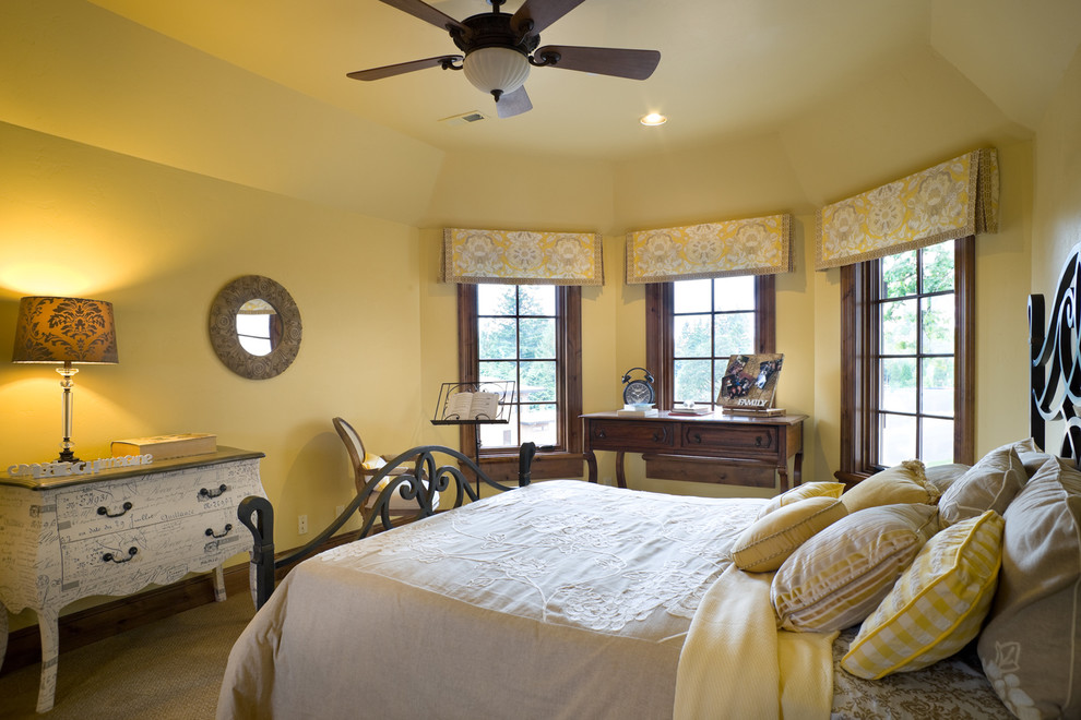 Elegant bedroom photo in Portland with yellow walls