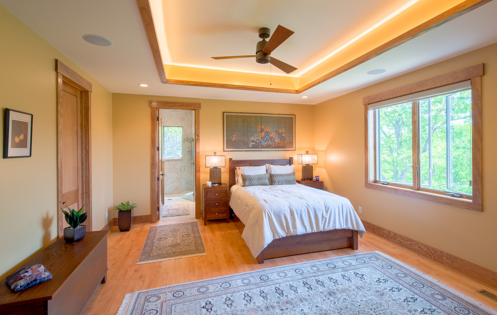 Idee per una camera da letto stile rurale con pavimento in legno massello medio