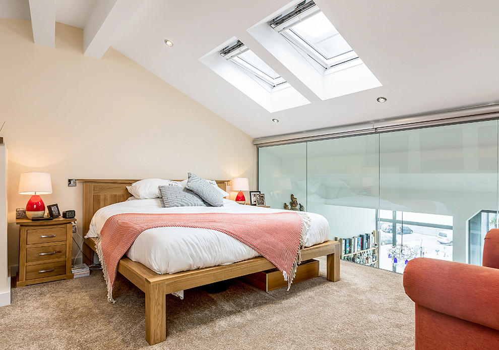 This is an example of a traditional bedroom in Hampshire with carpet.
