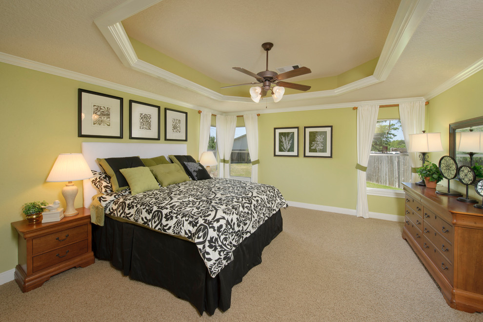 Large elegant master carpeted and beige floor bedroom photo in Houston with green walls and no fireplace
