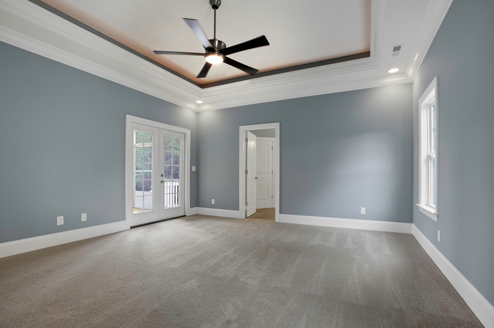 Design ideas for a large coastal master bedroom in Other with blue walls, carpet and no fireplace.