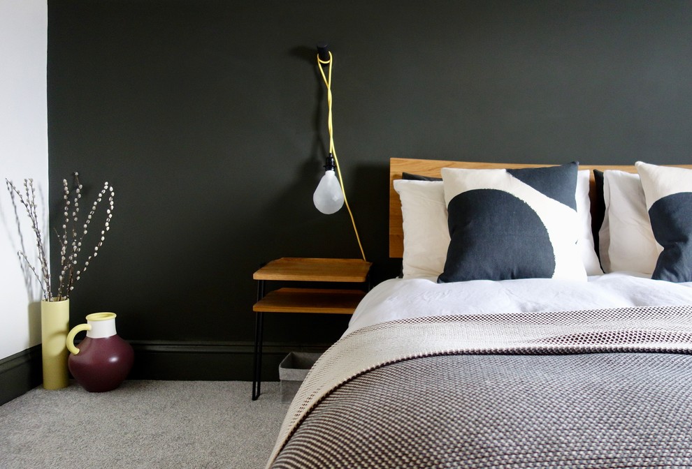 Large scandi guest bedroom in Other with white walls, carpet, a standard fireplace, a metal fireplace surround and grey floors.