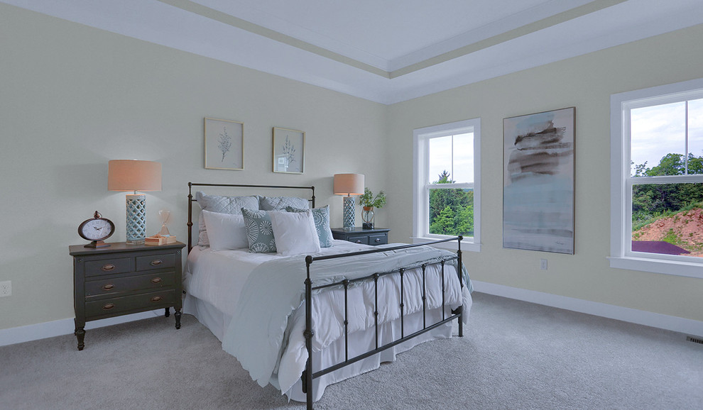 Inspiration for a large timeless master carpeted and beige floor bedroom remodel in Other with gray walls