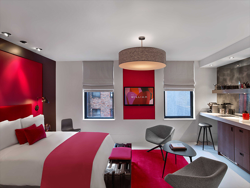 Example of a mid-sized trendy master bedroom design in New York with red walls