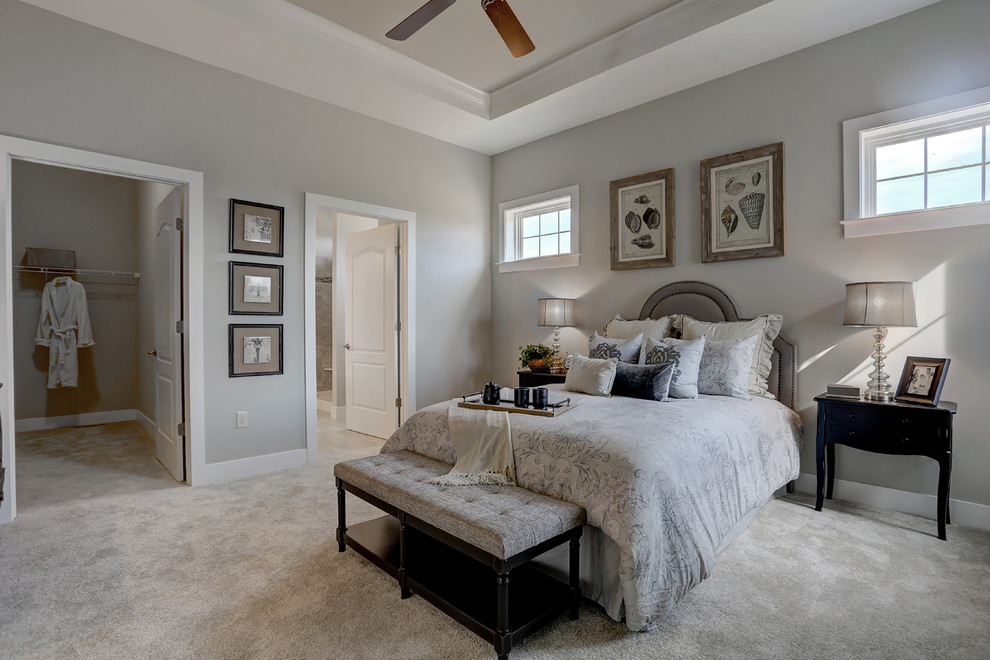 Large transitional master carpeted and beige floor bedroom photo in Other with beige walls and no fireplace