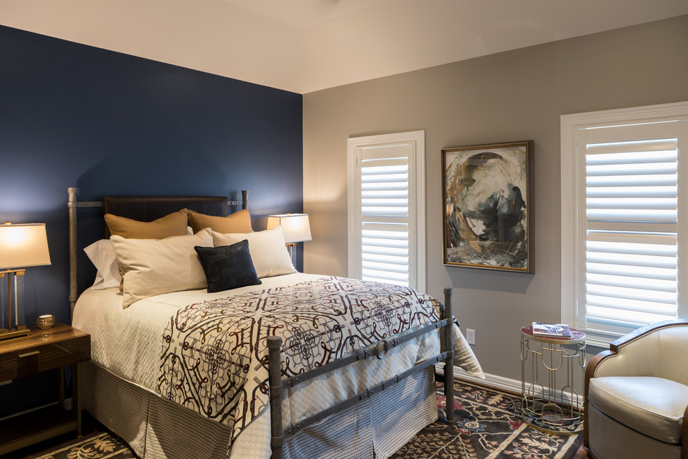 Inspiration for a mid-sized transitional guest dark wood floor and brown floor bedroom remodel in Houston with blue walls and no fireplace