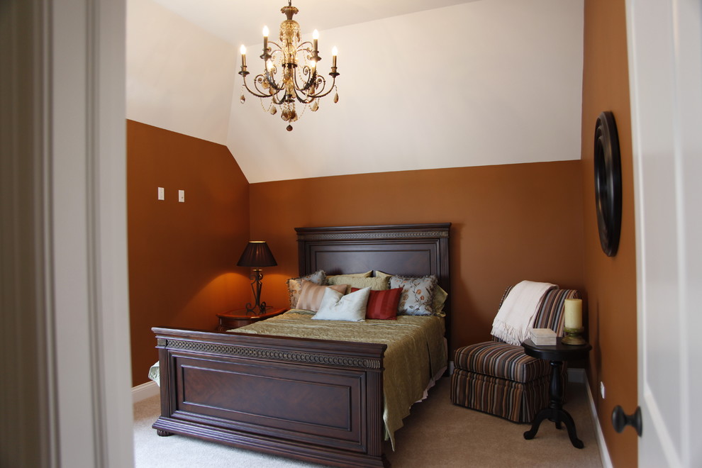 Mid-sized elegant guest carpeted bedroom photo in Chicago with orange walls