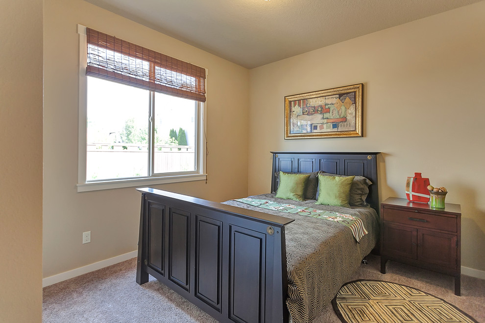 Photo of a medium sized traditional master bedroom in Portland with beige walls, carpet and no fireplace.