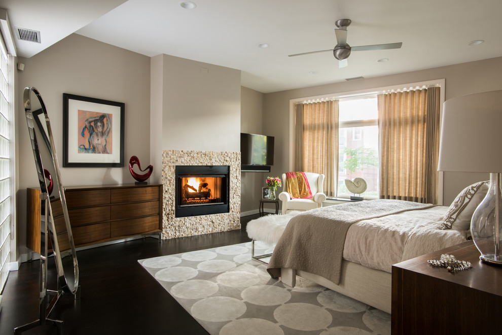 Inspiration for a contemporary bedroom in Chicago with a standard fireplace.