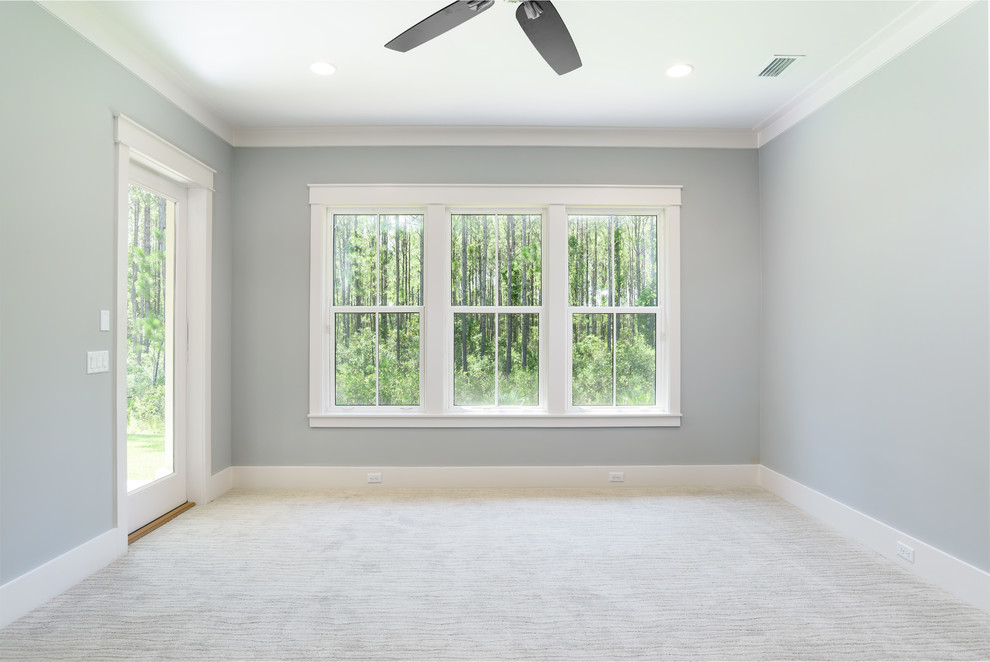 Foto de dormitorio costero de tamaño medio con moqueta, suelo multicolor y paredes azules