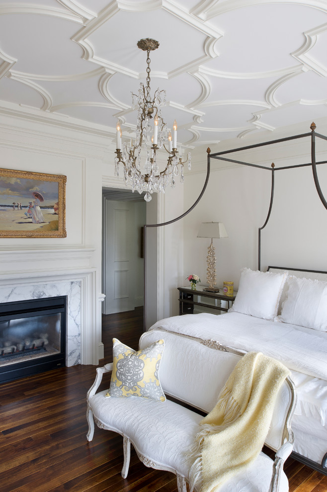 Example of a huge classic master medium tone wood floor bedroom design in Miami with a two-sided fireplace, a stone fireplace and white walls