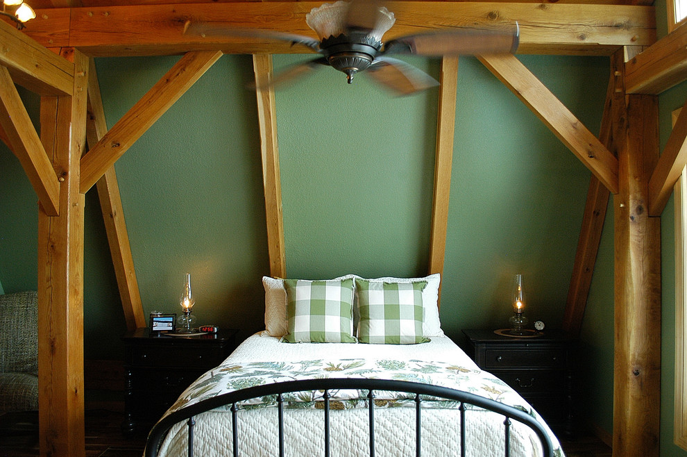 Design ideas for a medium sized rustic guest bedroom in Nashville with green walls.