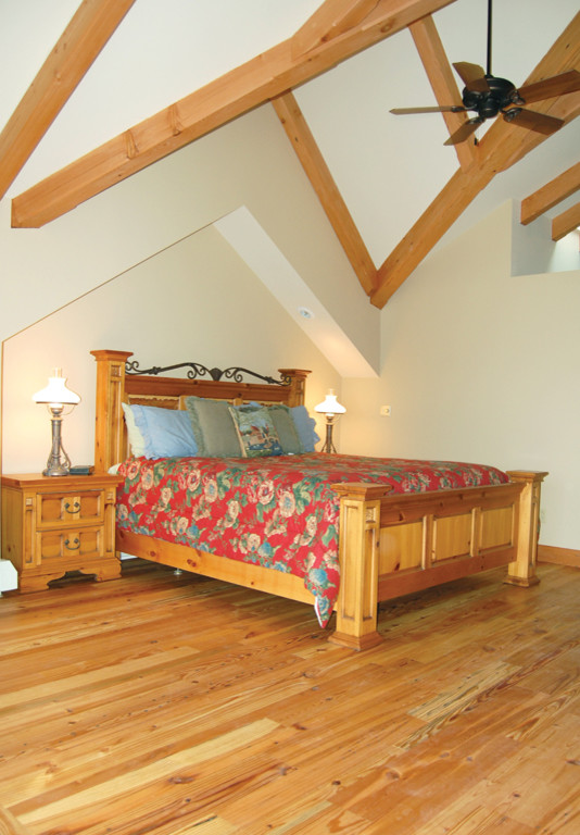Timber Frame Bedroom with Reclaimed Heart Pine Flooring Traditional