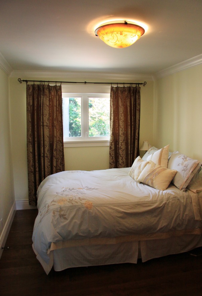 Example of a mid-sized farmhouse guest dark wood floor bedroom design in Vancouver with green walls