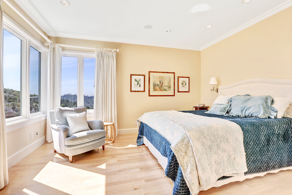 Bedroom - large traditional guest light wood floor bedroom idea in San Francisco with yellow walls