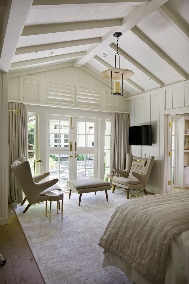 Inspiration for a coastal bedroom remodel in Other with white walls