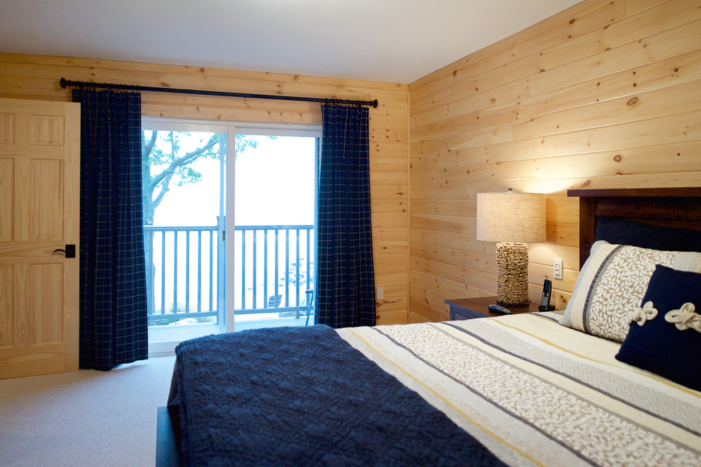 This is an example of a medium sized beach style master bedroom with carpet.