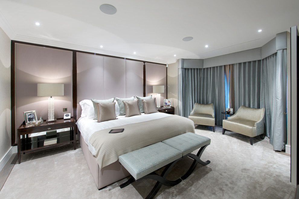 Medium sized contemporary master bedroom in London with beige walls, carpet, no fireplace, black floors, a coffered ceiling and wallpapered walls.