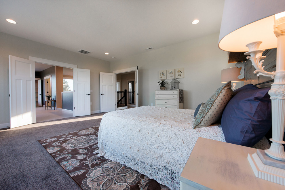 Example of a mid-sized classic master carpeted bedroom design in Portland with beige walls and no fireplace