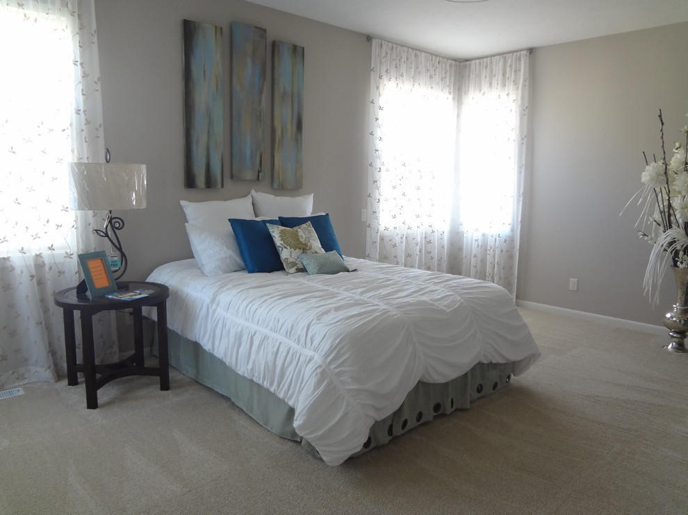 Photo of a medium sized traditional master and grey and silver bedroom in Portland with grey walls, carpet and no fireplace.