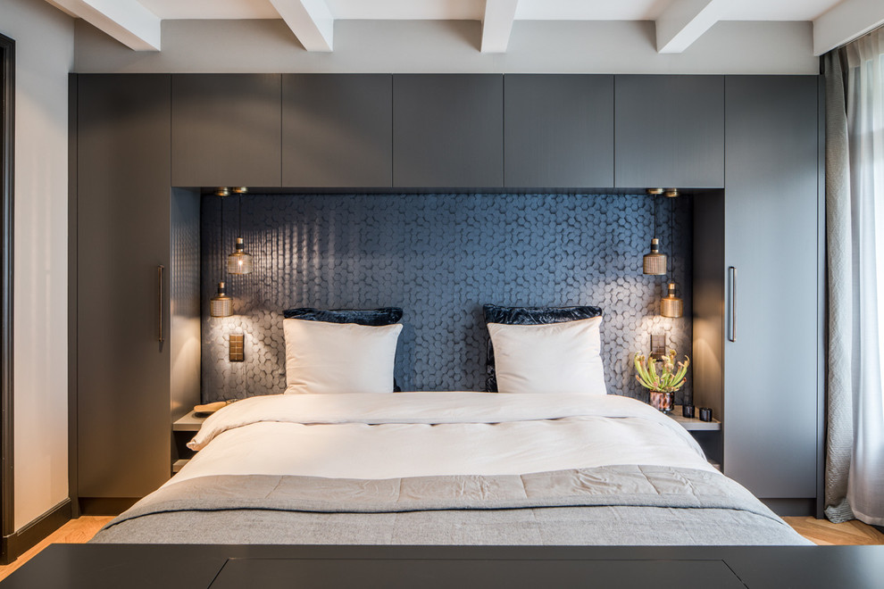 Inspiration for a contemporary master bedroom remodel in Amsterdam with gray walls