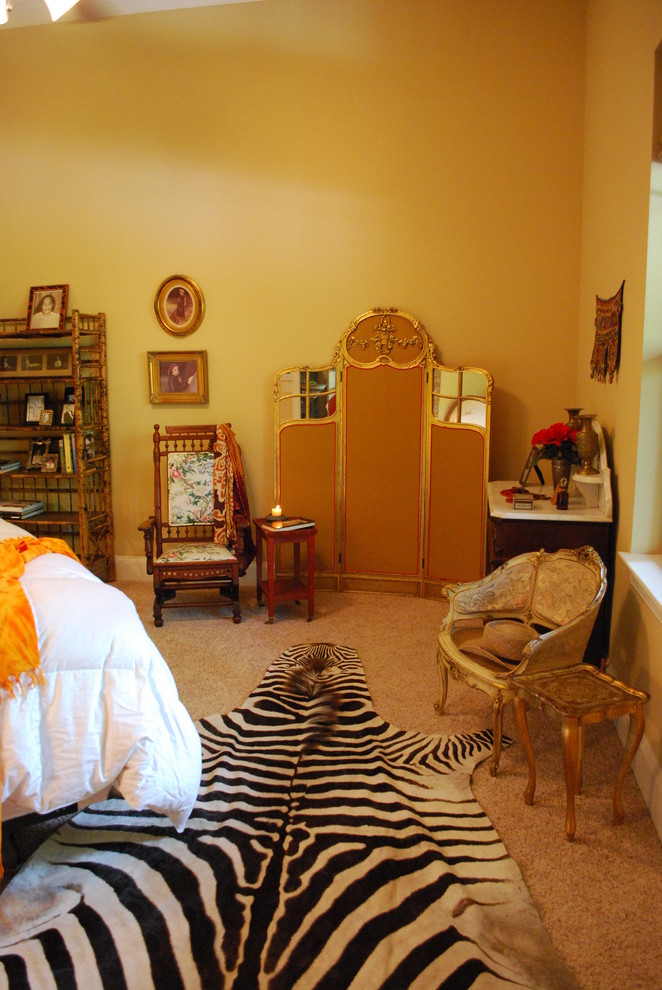 This is an example of an eclectic master bedroom in Austin.