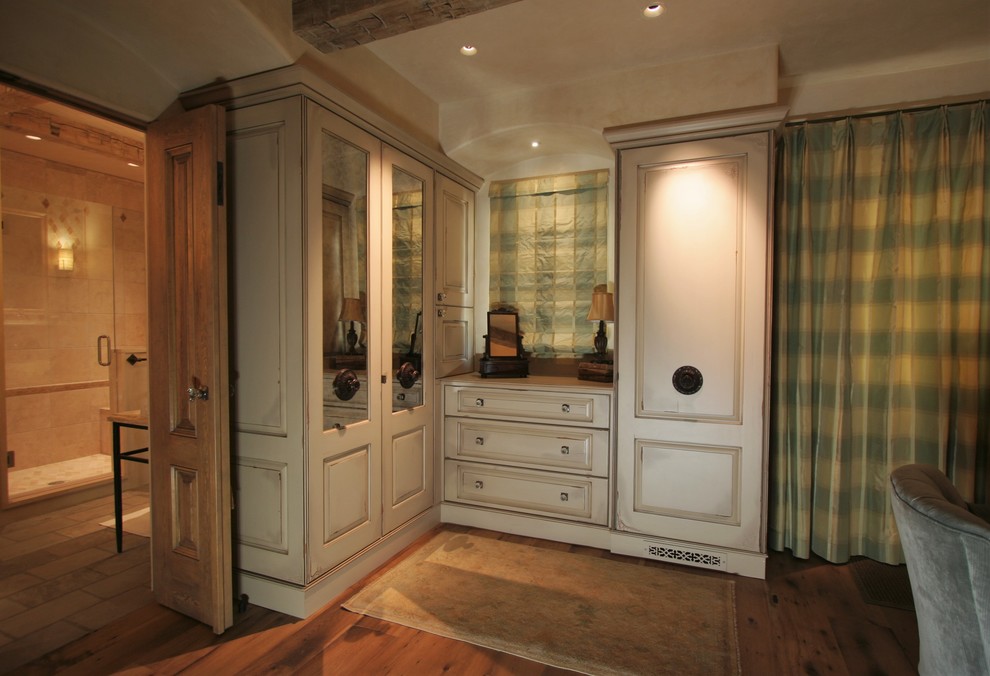 Inspiration for a large timeless master dark wood floor bedroom remodel in Denver with beige walls and no fireplace