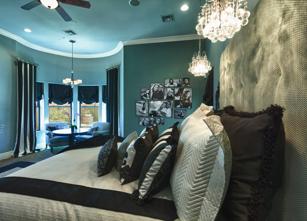 This is an example of a large classic master bedroom in Phoenix with blue walls, carpet and no fireplace.