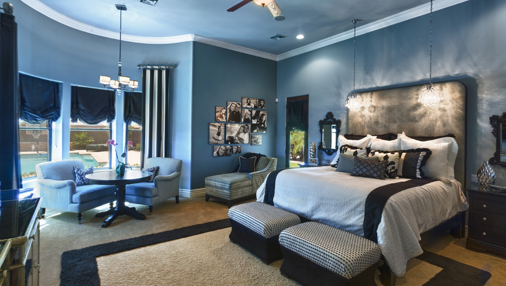 Large traditional master bedroom in Phoenix with blue walls, carpet and no fireplace.