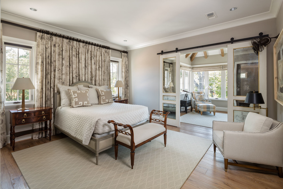 Inspiration for a classic bedroom in Houston with grey walls, medium hardwood flooring and no fireplace.