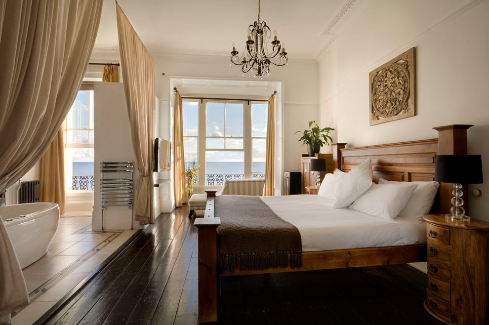 Inspiration for a traditional master bedroom in Other with white walls and dark hardwood flooring.