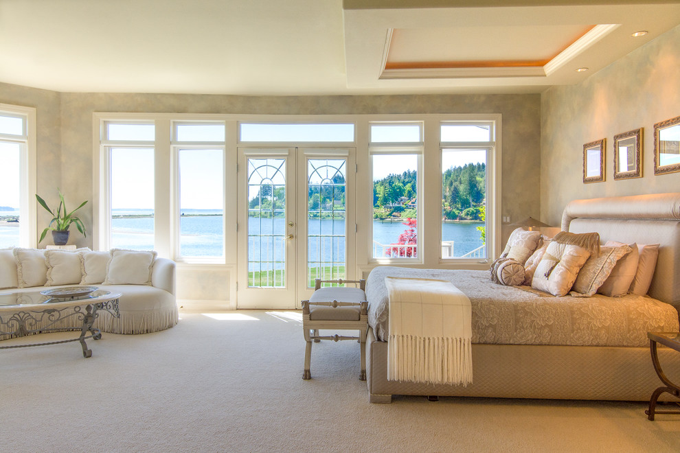 Design ideas for a large classic master bedroom in Seattle with beige walls and carpet.