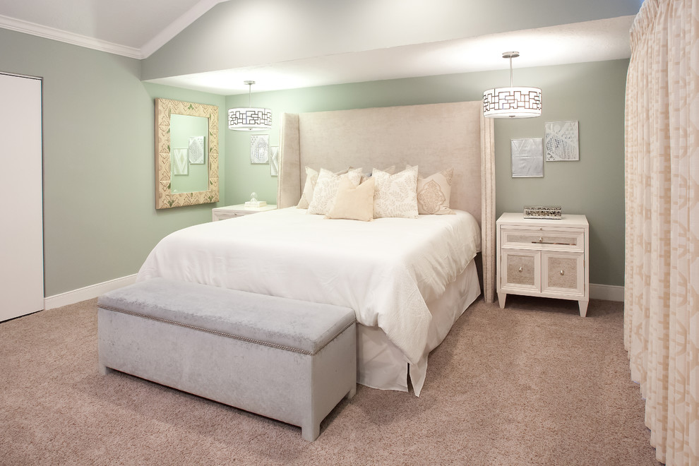 This is an example of a traditional bedroom in Houston with green walls.